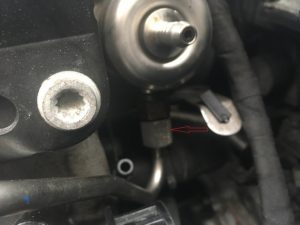 A disconnected Fuel line on an Audi intake manifold.