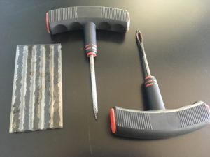 Three piece Repair kit tools needed to fix a car tire.