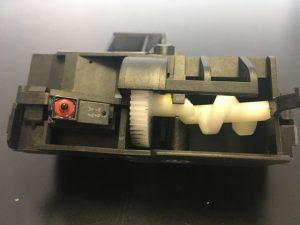 Volvo latch actuator with a broken axle.