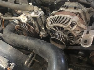 Subaru engine, alternator and power steering pump with Serpentine Belt removed.