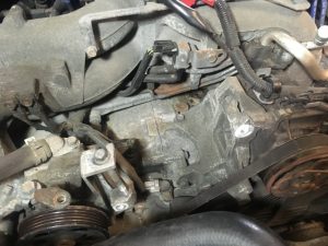 Forester 2.5 liter flat engine with alternator removed.