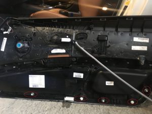 Inner part of BMW drivers front door panel completely removed from the car.