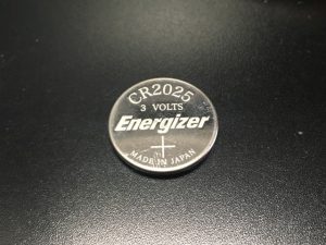 An infiniti remote key-less entry battery, model CR2025 3 volts.