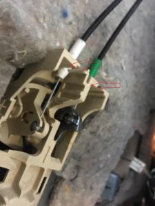 Lexus Door latch cables attached on door handle, green and white color connectors.