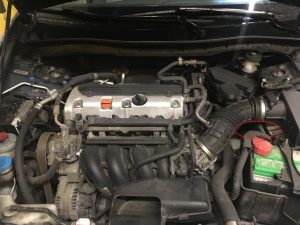A Honda accord engine 4 cyliner 2.4L engine bay.