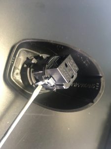 Usage of a flat screwdriver to disassembly Volkswagen Engine Start button.