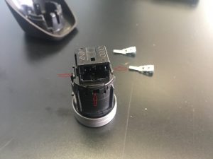 Volkswagen Engine Start Button with pins and clips removed.