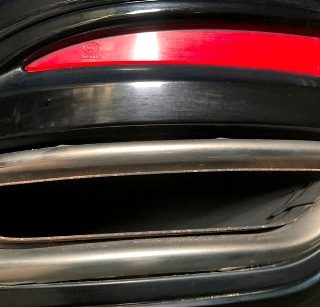 Vehicle muffler exhaust where emission testing tool is inserted to complete an Ontario drive clean test.