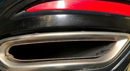 Vehicle muffler exhaust where emission testing tool is inserted to complete an Ontario drive clean test.