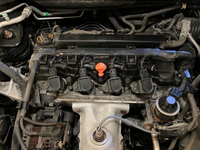 Acura ILX with top engine cover removed.